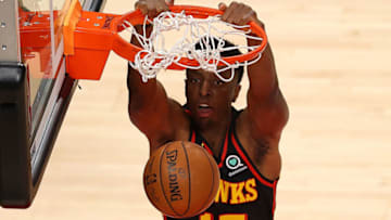 ATLANTA, GEORGIA - MAY 16: Onyeka Okongwu #17 of the Atlanta Hawks drunks against the Houston Rockets during the first half at State Farm Arena on May 16, 2021 in Atlanta, Georgia. NOTE TO USER: User expressly acknowledges and agrees that, by downloading and or using this photograph, User is consenting to the terms and conditions of the Getty Images License Agreement. (Photo by Kevin C. Cox/Getty Images)