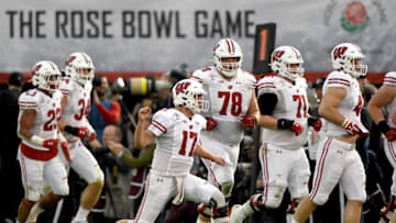 PASADENA, CALIFORNIA - JANUARY 01: Jack Coan #17 of the Wisconsin Badgers celebrates after Mason Stokke #34 scored a one yard touchdown against the Oregon Ducks during the third quarter in the Rose Bowl game presented by Northwestern Mutual at Rose Bowl on January 01, 2020 in Pasadena, California. (Photo by Kevork Djansezian/Getty Images)