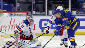 Apr 1, 2021; Buffalo, New York, USA; New York Rangers goaltender Igor Shesterkin (31) watches as Buffalo Sabres right wing Kyle Okposo (21) reaches for the puck during the first period at KeyBank Center. Mandatory Credit: Timothy T. Ludwig-USA TODAY Sports