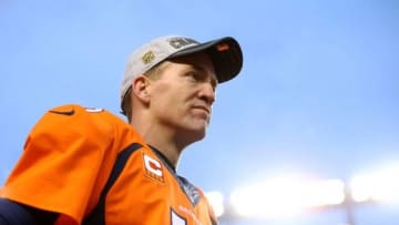 Jan 24, 2016; Denver, CO, USA; Denver Broncos quarterback Peyton Manning (18) against the New England Patriots in the AFC Championship football game at Sports Authority Field at Mile High. The Broncos defeated the Patriots 20-18 to advance to the Super Bowl. Mandatory Credit: Mark J. Rebilas-USA TODAY Sports