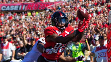 LUBBOCK, TEXAS - OCTOBER 05: Wide receiver KeSean Carter #82 of the Texas Tech Red Raiders catches a touchdown pass during the first half of the college football game between the Texas Tech Red Raiders and the Oklahoma State Cowboys on October 05, 2019 at Jones AT&T Stadium in Lubbock, Texas. (Photo by John E. Moore III/Getty Images)