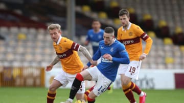 MOTHERWELL, SCOTLAND - JANUARY 17: Ryan Kent of Rangers is challenged by Robbie Crawford of Motherwell during the Ladbrokes Scottish Premiership match between Motherwell and Rangers at Fir Park on January 17, 2021 in Motherwell, Scotland. Sporting stadiums around Scotland remain under strict restrictions due to the Coronavirus Pandemic as Government social distancing laws prohibit fans inside venues resulting in games being played behind closed doors. (Photo by Ian MacNicol/Getty Images)
