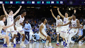 NEW ORLEANS, LOUISIANA - APRIL 04: Kansas Jayhawks players celebrate after defeating the North Carolina Tar Heels 72-69 during the 2022 NCAA Men's Basketball Tournament National Championship at Caesars Superdome on April 04, 2022 in New Orleans, Louisiana. (Photo by Jamie Squire/Getty Images)