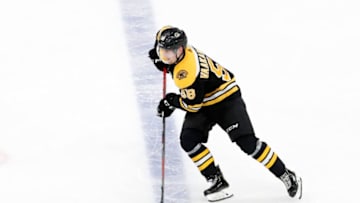 BOSTON, MA - NOVEMBER 16: Boston Bruins defenseman Urho Vaakanainen (58) carries the puck during a game between the Boston Bruins and the Washington Capitals on November 16, 2019, at TD Garden in Boston, Massachusetts. (Photo by Fred Kfoury III/Icon Sportswire via Getty Images)