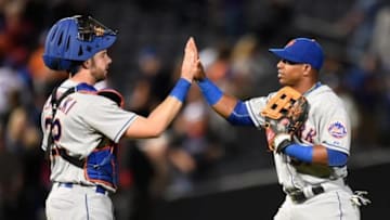 Sep 12, 2015; Atlanta, GA, USA; New York Mets catcher Kevin Plawecki (22) and center fielder Yoenis Cespedes (52) react after defeating the Atlanta Braves at Turner Field. The Mets defeated the Braves 6-4. Mandatory Credit: Dale Zanine-USA TODAY Sports