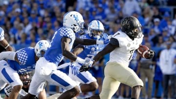 Oct 8, 2016; Lexington, KY, USA; Vanderbilt Commodores running back Ralph Webb (7) runs the ball against the Kentucky Wildcats in the first half at Commonwealth Stadium. Mandatory Credit: Mark Zerof-USA TODAY Sports
