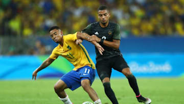 RIO DE JANEIRO, BRAZIL - AUGUST 20: Gabriel Jesus of Brazil holds off Jeremy Toljan of Germany during the Men's Football Final between Brazil and Germany at the Maracana Stadium on Day 15 of the Rio 2016 Olympic Games on August 20, 2016 in Rio de Janeiro, Brazil. (Photo by Lars Baron/Getty Images)