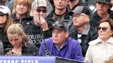 May 13, 2018; Denver, CO, USA; Colorado Rockies co-owner Dick Monfort (center) watches during the fourth inning of the game against the Milwaukee Brewers at Coors Field. Mandatory Credit: Isaiah J. Downing-USA TODAY Sports