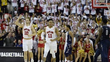 Nov 17, 2015; College Park, MD, USA; Maryland Terrapins guard Jared Nickens (11) and Maryland Terrapins forward Jake Layman (10) reacts after defeating Georgetown Hoyas 75-71 at Xfinity Center. Mandatory Credit: Tommy Gilligan-USA TODAY Sports