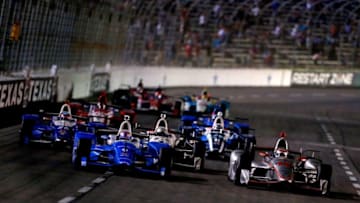 FORT WORTH, TX - JUNE 10: Will Power, driver of the #12 Verizon Team Penske Chevrolet, and Scott Dixon, driver of the #9 NTT Data Chip Ganassi Racing Honda, lead the field during the Verizon IndyCar Series Rainguard Water Sealers 600 at Texas Motor Speedway on June 10, 2017 in Fort Worth, Texas. (Photo by Sean Gardner/Getty Images)