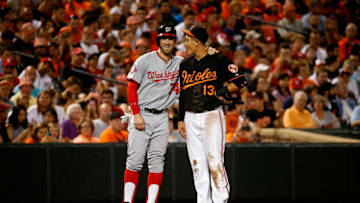 BALTIMORE, MD - JULY 10: Bryce Harper #34 of the Washington Nationals and Manny Machado #13 of the Baltimore Orioles talk during their game at Oriole Park at Camden Yards on July 10, 2015 in Baltimore, Maryland. (Photo by Rob Carr/Getty Images)