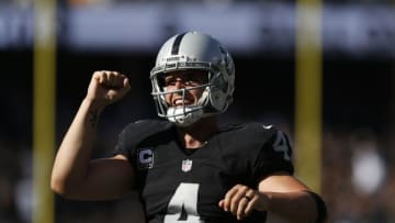 Oct 9, 2016; Oakland, CA, USA; Oakland Raiders quarterback Derek Carr (4) reacts after throwing a touchdown pass against the San Diego Chargers in the third quarter at Oakland Coliseum. The Raiders defeated the Chargers 34-31. Mandatory Credit: Cary Edmondson-USA TODAY Sports