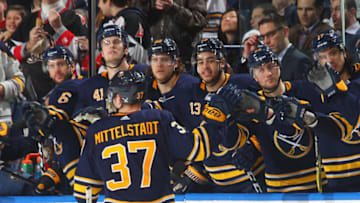 BUFFALO, NY - MARCH 29: Casey Mittelstadt #37 of the Buffalo Sabres celebrates his first NHL point picking up an assist in his first NHL game against the Detroit Red Wings on March 29, 2018 at KeyBank Center in Buffalo, New York. (Photo by Bill Wippert/NHLI via Getty Images)
