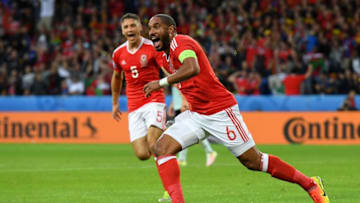 LILLE, FRANCE - JULY 01: Ashley Williams of Wales celebrates scoring his team's first goal during the UEFA EURO 2016 quarter final match between Wales and Belgium at Stade Pierre-Mauroy on July 1, 2016 in Lille, France. (Photo by Matthias Hangst/Getty Images)