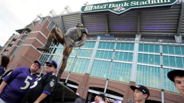 Sep 11, 2014; Baltimore, MD, USA; Fans pose for photos in front of a statue of former Baltimore Ravens linebacker Ray Lewis prior to the game against the Pittsburgh Steelers at M&T Bank Stadium. Mandatory Credit: Evan Habeeb-USA TODAY Sports