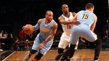 Dec 7, 2016; Brooklyn, NY, USA; Denver Nuggets guard Jameer Nelson (1) drives as forward Nikola Jokic (15) is held off by Brooklyn Nets guard Isaiah Whitehead (15) during the first quarter at Barclays Center. Mandatory Credit: Anthony Gruppuso-USA TODAY Sports