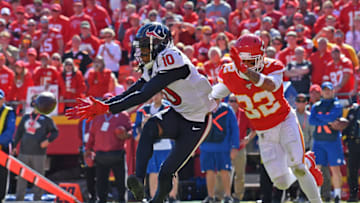KANSAS CITY, MO - OCTOBER 13: Wide receiver DeAndre Hopkins #10 of the Houston Texans reaches out for the ball against the strong safety Tyrann Mathieu #32 of the Kansas City Chiefs during the second half at Arrowhead Stadium on October 13, 2019 in Kansas City, Missouri. (Photo by Peter Aiken/Getty Images)