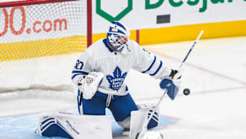 MONTREAL, QUEBEC - OCTOBER 26: Michael Hutchinson #30 of the Toronto Maple Leafs makes a save with the blocker during warm-up against the Montreal Canadiens at Centre Bell on October 26, 2019 in Montreal, Quebec. (Photo by Stephane Dube /Getty Images)