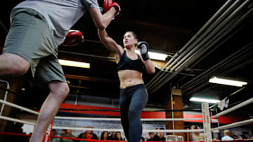 CHICAGO, IL - JULY 23: UFC women's No. 5 bantamweight contender Jessica Eye with boxing coach Alex Cooper during UFC Fight Night: Open Workouts at UFC Gym River North on July 23, 2015 in Chicago, Illinois. (Photo by Jon Durr/Zuffa LLC/Zuffa LLC via Getty Images)