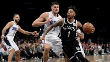 NEW YORK, NY - OCTOBER 20: D'Angelo Russell #1 of the Brooklyn Nets drives to the basket against Nikola Vucevic #9 of the Orlando Magic in the second half during their game at Barclays Center on October 20, 2017 in the Brooklyn borough of New York City. NOTE TO USER: User expressly acknowledges and agrees that, by downloading and or using this photograph, User is consenting to the terms and conditions of the Getty Images License Agreement. (Photo by Abbie Parr/Getty Images)