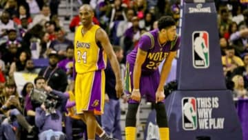 Feb 4, 2016; New Orleans, LA, USA; Los Angeles Lakers forward Kobe Bryant (24) and New Orleans Pelicans forward Anthony Davis (23) react during the second quarter of a game at the Smoothie King Center. Mandatory Credit: Derick E. Hingle-USA TODAY Sports