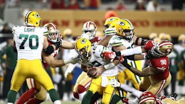 SANTA CLARA, CALIFORNIA - NOVEMBER 24: Quarterback Aaron Rodgers #12 of the Green Bay Packers is sacked by defensive end Nick Bosa #97 of the San Francisco 49ers during the 1st half of the game at Levi's Stadium on November 24, 2019 in Santa Clara, California. (Photo by Ezra Shaw/Getty Images)