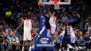 DALLAS, TEXAS - OCTOBER 23: Dorian Finney-Smith #10 of the Dallas Mavericks drives to the basket against Rui Hachimura #8 of the Washington Wizards in the first half at American Airlines Center on October 23, 2019 in Dallas, Texas. NOTE TO USER: User expressly acknowledges and agrees that, by downloading and or using this photograph, User is consenting to the terms and conditions of the Getty Images License Agreement. (Photo by Tom Pennington/Getty Images)