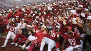 Dec 3, 2016; Norman, OK, USA; Oklahoma Sooners coaches and players take a team photo with the Big 12 championship trophy after the game against the Oklahoma State Cowboys at Gaylord Family - Oklahoma Memorial Stadium. Mandatory Credit: Kevin Jairaj-USA TODAY Sports