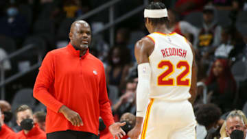 Oct 14, 2021; Atlanta, Georgia, USA; Atlanta Hawks head coach Nate McMillan talks to forward Cam Reddish (22) against the Miami Heat in the first half at State Farm Arena. Mandatory Credit: Brett Davis-USA TODAY Sports