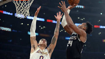 March 24, 2019; Los Angeles, CA, USA; Sacramento Kings guard Buddy Hield (24) moves to the basket against Los Angeles Lakers forward Kyle Kuzma (0) during the first half at Staples Center. Mandatory Credit: Gary A. Vasquez-USA TODAY Sports