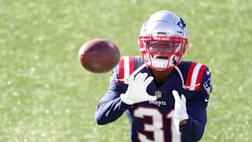 FOXBOROUGH, MASSACHUSETTS - NOVEMBER 29: Jonathan Jones #31 of the New England Patriots warms up before the game against the Arizona Cardinals at Gillette Stadium on November 29, 2020 in Foxborough, Massachusetts. (Photo by Maddie Meyer/Getty Images)