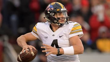 MADISON, WI - NOVEMBER 11: Nathan Stanley #4 of the Iowa Hawkeyes drops back to pass during the second quarter of a game against the Wisconsin Badgers at Camp Randall Stadium on November 11, 2017 in Madison, Wisconsin. (Photo by Stacy Revere/Getty Images)