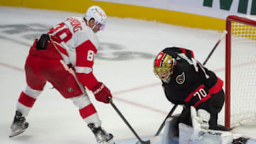 Oct 21, 2023; Ottawa, Ontario, CAN; Detroit Red Wings right wing Daniel Sprong (88) shoots on Ottawa Senators goalie Joonas Korpisalo (70) in the third period at the Canadian Tire Centre. Mandatory Credit: Marc DesRosiers-USA TODAY Sports
