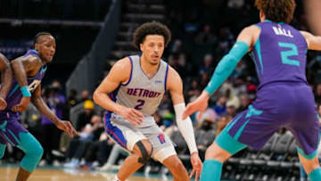 Detroit Pistons guard Cade Cunningham (2) dribbles against Charlotte Hornets guard LaMelo Ball (2) Credit: Jim Dedmon-USA TODAY Sportsthe