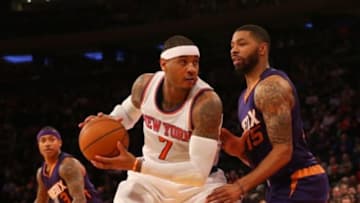 Dec 20, 2014; New York, NY, USA; Phoenix Suns forward Marcus Morris (15) defends New York Knicks forward Carmelo Anthony (7) during the fourth quarter at Madison Square Garden. Phoenix Suns won 99-90. Mandatory Credit: Anthony Gruppuso-USA TODAY Sports