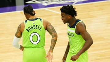 Anthony Edwards celebrates a break away dunk with D'Angelo Russell of the Minnesota Timberwolves. (Photo by Daniel Shirey/Getty Images)