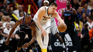 MIAMI, FL - JANUARY 08: Bam Adebayo #13 of the Miami Heat battles for the ball with Nikola Jokic #15 of the Denver Nuggets during the second half at American Airlines Arena on January 8, 2019 in Miami, Florida. NOTE TO USER: User expressly acknowledges and agrees that, by downloading and or using this photograph, User is consenting to the terms and conditions of the Getty Images License Agreement. (Photo by Michael Reaves/Getty Images)
