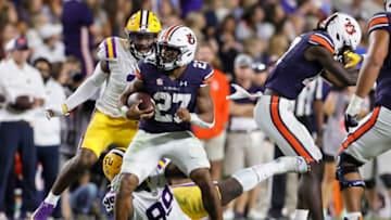Auburn footballOct 1, 2022; Auburn, Alabama, USA; Auburn Tigers running back Jarquez Hunter (27) avoids the tackle of LSU Tigers defensive tackle Jaquelin Roy (99) during the third quarter at Jordan-Hare Stadium. Mandatory Credit: John Reed-USA TODAY Sports