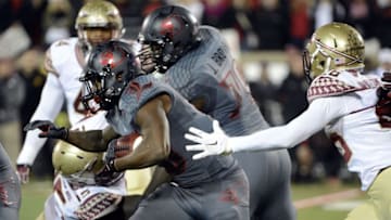 Oct 30, 2014; Louisville, KY, USA; Louisville Cardinals running back Brandon Radcliff (23) runs the ball against the Florida State Seminoles during the first quarter at Papa John