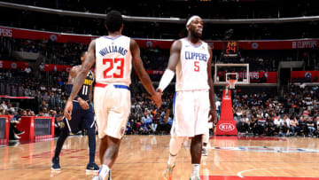 LOS ANGELES, CA - OCTOBER 9: Montrezl Harrell #5 of the LA Clippers shakes hands with Lou Williams #23 of the LA Clippers against the Denver Nuggets during a pre-season game on October 9, 2018 at Staples Center in Los Angeles, California. NOTE TO USER: User expressly acknowledges and agrees that, by downloading and/or using this photograph, User is consenting to the terms and conditions of the Getty Images License Agreement. Mandatory Copyright Notice: Copyright 2018 NBAE (Photo by Adam Pantozzi/NBAE via Getty Images)
