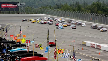 Aug 1, 2016; Long Pond, PA, USA; NASCAR Sprint Cup Series driver Martin Truex Jr (78) leads the field into turn one during the Pennsylvania 400 at Pocono Raceway. Mandatory Credit: Matthew O