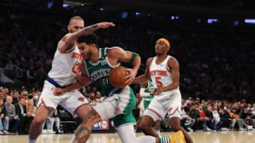NEW YORK, NEW YORK - JANUARY 06: Jayson Tatum #0 of the Boston Celtics drives against Evan Fournier #13 of the New York Knicks during their game at Madison Square Garden on January 06, 2022 in New York City. NOTE TO USER: User expressly acknowledges and agrees that, by downloading and or using this photograph, User is consenting to the terms and conditions of the Getty Images License Agreement. (Photo by Al Bello/Getty Images)