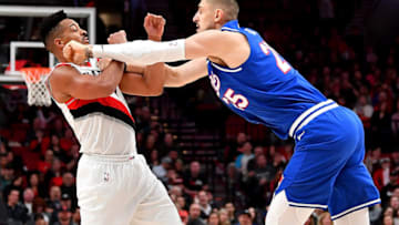 PORTLAND, OREGON - MARCH 07: CJ McCollum #3 of the Portland Trail Blazers (L) and Alex Len #25 of the Sacramento Kings square up and receive double technicals during the second half of the game at the Moda Center on March 07, 2020 in Portland, Oregon. The Sacramento Kings topped the Portland Trail Blazers, 123-111. NOTE TO USER: User expressly acknowledges and agrees that, by downloading and or using this photograph, User is consenting to the terms and conditions of the Getty Images License Agreement. (Photo by Alika Jenner/Getty Images)