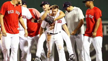 BOSTON, MA - AUGUST 06: Tony Renda #38 of the Boston Red Sox who scored the game-winning run gives a piggy back ride to Joe Kelly #56 of the Boston Red Sox after a victory over the New York Yankees at Fenway Park on August 6, 2018 in Boston, Massachusetts. (Photo by Adam Glanzman/Getty Images)