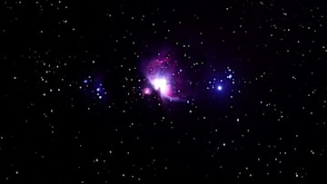 This long exposure picture taken late on November 22, 2017 shows the Orion Nebula (C), a diffuse nebula situated in the Milky Way, seen from Wundwin, near the Myanmar city of Mandalay. / AFP PHOTO / YE AUNG THU (Photo credit should read YE AUNG THU/AFP/Getty Images)