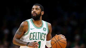 BOSTON, MASSACHUSETTS - DECEMBER 19: Kyrie Irving #11 of the Boston Celtics dribbles against the Phoenix Suns at TD Garden on December 19, 2018 in Boston, Massachusetts. The Suns defeat the Celtics 111-103. NOTE TO USER: User expressly acknowledges and agrees that, by downloading and or using this photograph, User is consenting to the terms and conditions of the Getty Images License Agreement. (Photo by Maddie Meyer/Getty Images)