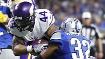 Nov 24, 2016; Detroit, MI, USA; Minnesota Vikings running back Matt Asiata (44) breaks a tackle from Detroit Lions strong safety Tavon Wilson (32) for a touchdown run during the first quarter at Ford Field. Mandatory Credit: Raj Mehta-USA TODAY Sports