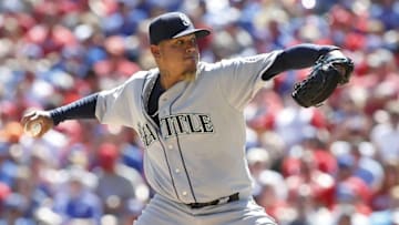 Apr 4, 2016; Arlington, TX, USA; Seattle Mariners starting pitcher Felix Hernandez (34) throws a pitch in the first inning against the Texas Rangers at Globe Life Park in Arlington. Mandatory Credit: Tim Heitman-USA TODAY Sports