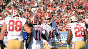 LOS ANGELES, CA - DECEMBER 31: Quarterback Jimmy Garoppolo #10 of the San Francisco 49ers congratulates Marquise Goodwin #11 of the San Francisco 49ers after scoring a touchdown during the first quarter against Los Angeles Rams at Los Angeles Memorial Coliseum on December 31, 2017 in Los Angeles, California. (Photo by Kevork Djansezian/Getty Images)