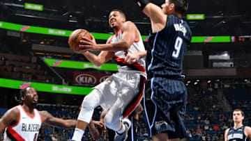 ORLANDO, FL - DECEMBER 15: CJ McCollum #3 of the Portland Trail Blazers handles the ball against the Orlando Magic on December 15, 2017 at Amway Center in Orlando, Florida. NOTE TO USER: User expressly acknowledges and agrees that, by downloading and or using this photograph, User is consenting to the terms and conditions of the Getty Images License Agreement. Mandatory Copyright Notice: Copyright 2017 NBAE (Photo by Fernando Medina/NBAE via Getty Images)